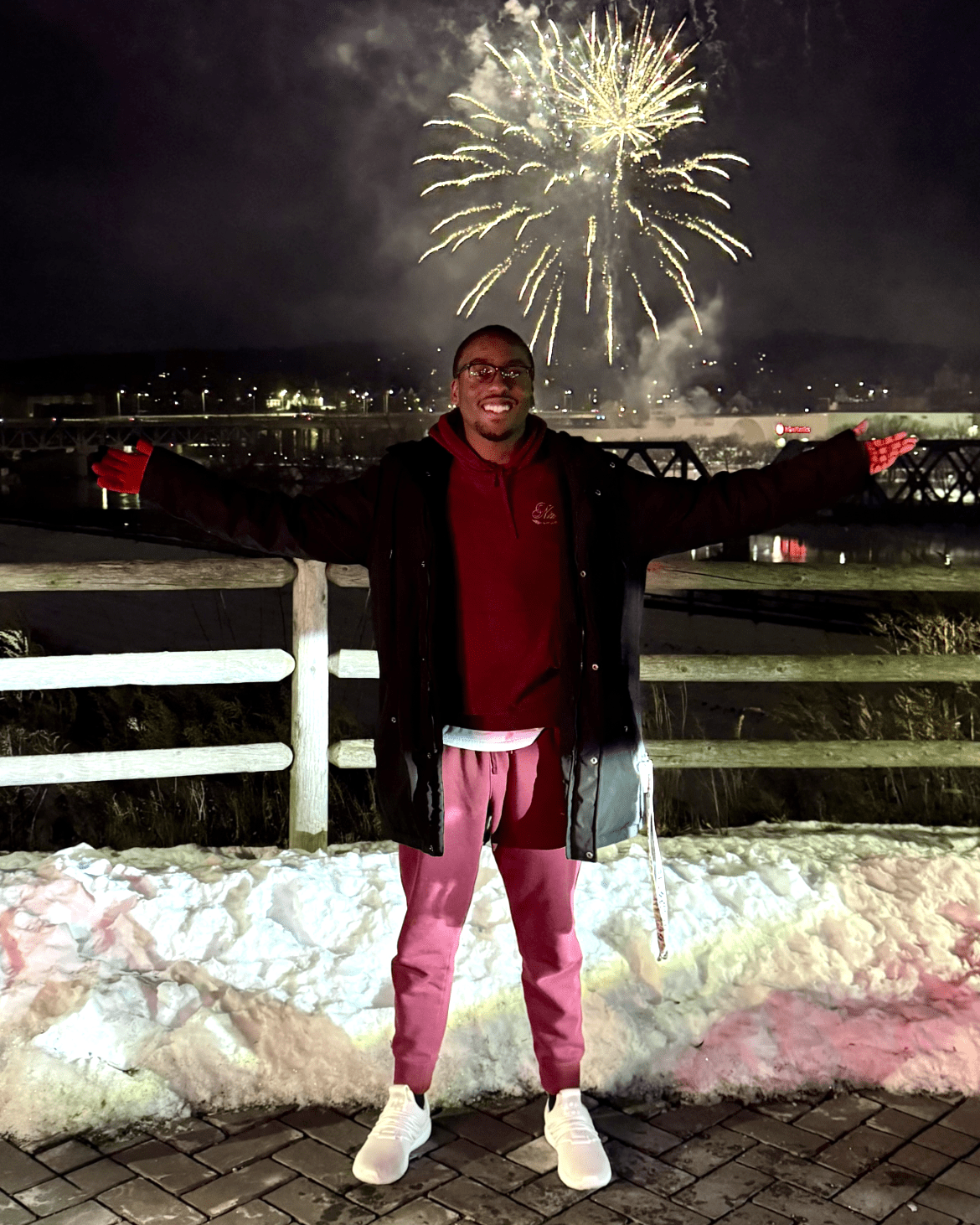 male portrait with a firework in the background